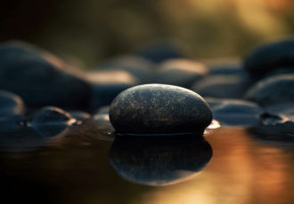 Smooth stones balance on wet water surface generated by artificial intelligence